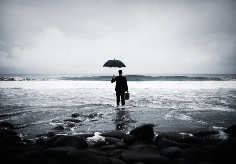 Lonely Businessman Alone in the Beach